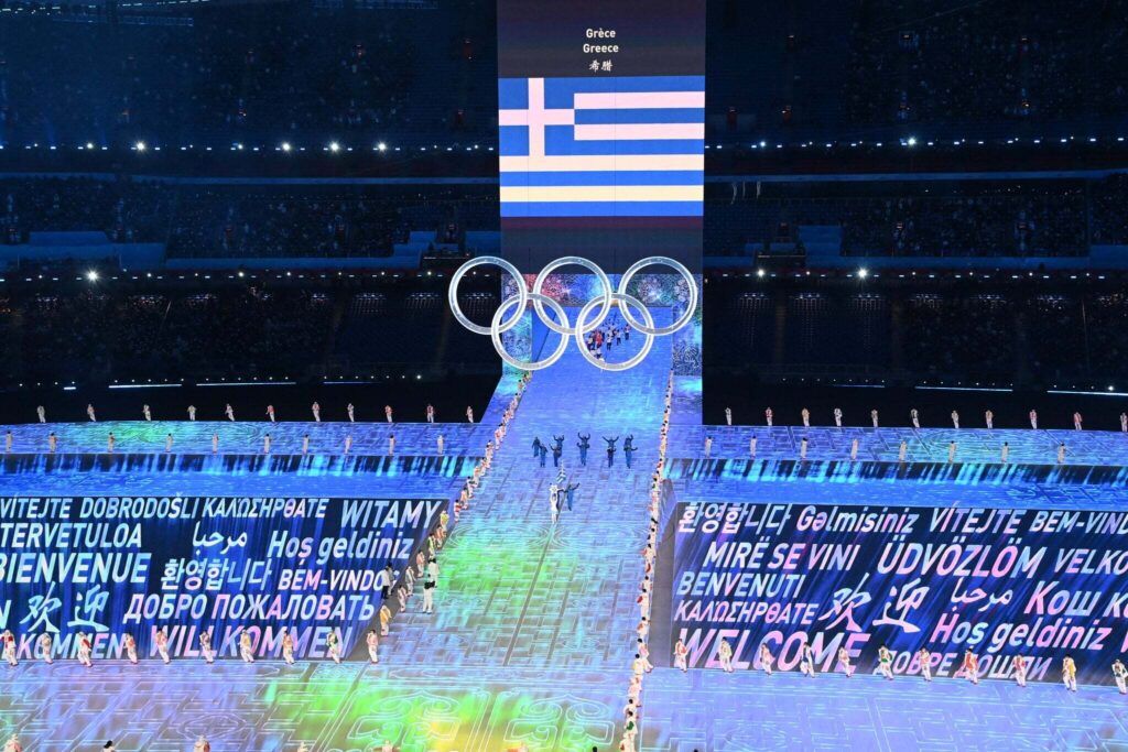 Η Αρχαία Ολυμπία Φωτίζει την Παγκόσμια Κοινότητα στην Κορτίνα για τους Χειμερινούς Ολυμπιακούς Αγώνες με 3.500 Αθλητές από 91 Κράτη